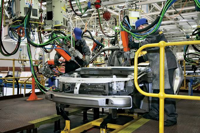 Automotive assembly line using pressed vehicle body components