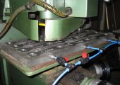 Metal engraving detail on a Pressform component