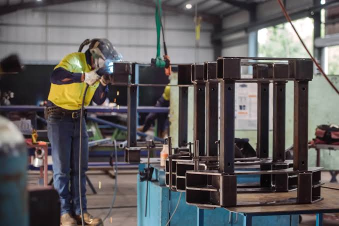 Welder fabricating an equipment frame for an OEM customer