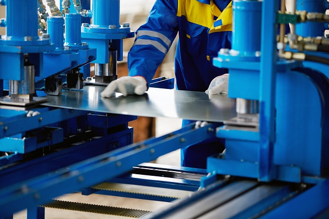 Metal pressing a cut steel sheet at Pressform, Perth