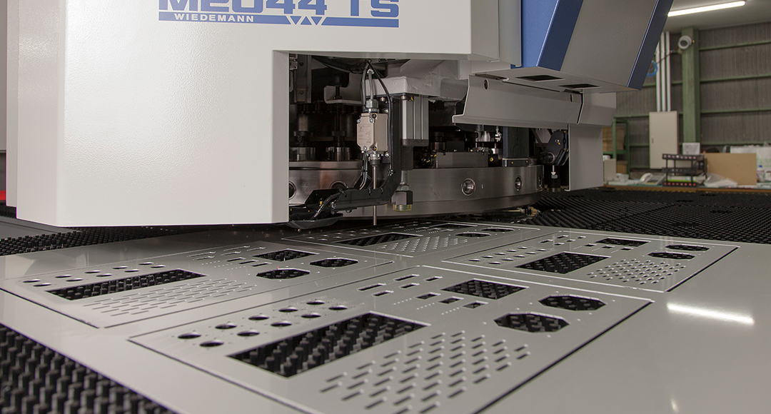 CNC turret press punching a perforated steel panel at Pressform, Perth