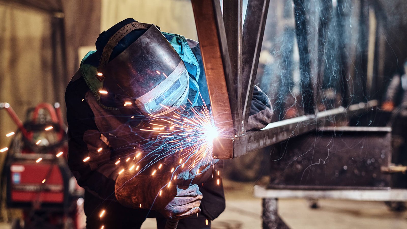 Welder fabricating a steel frame at Pressform Engineering, Perth